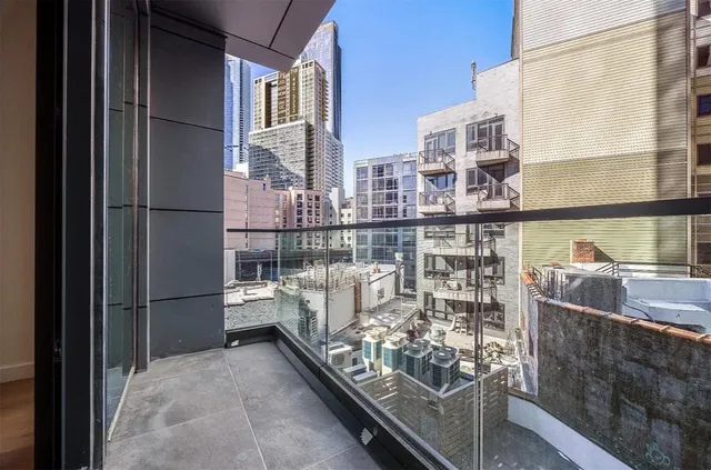 a view of balcony with furniture
