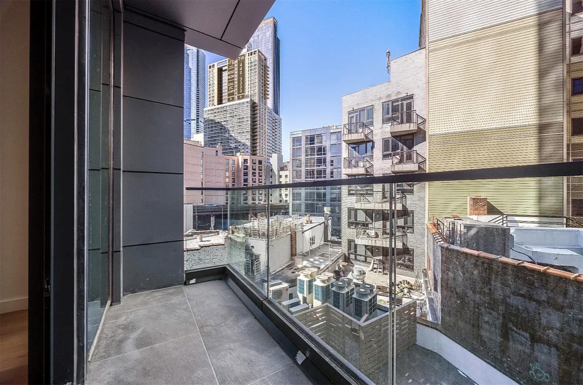 42-62 Hunter Street, Unit 3C Queens, NY 11101 - Photo 9 of 11 a view of balcony with furniture