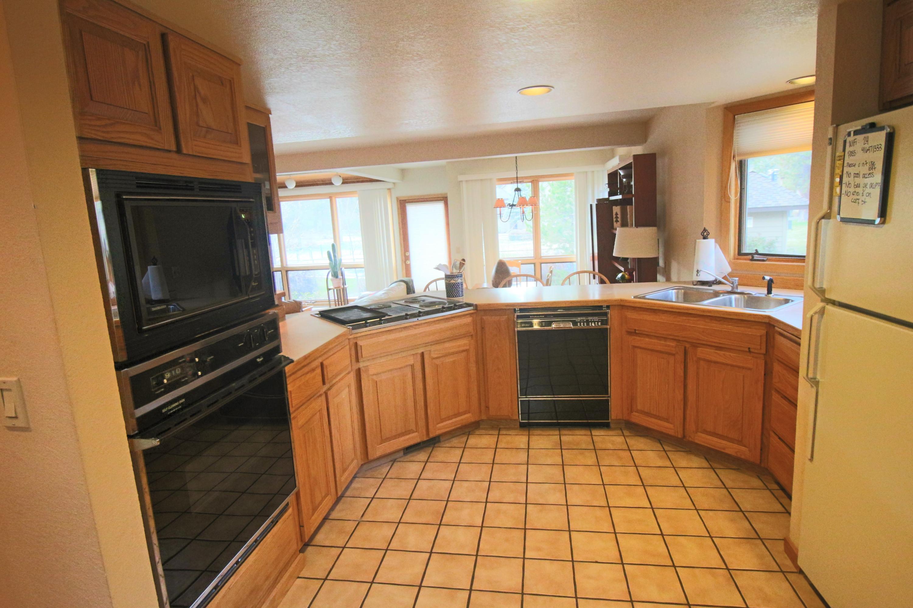 17693 Bittern Lane Sunriver, OR 97707 - Photo 8 of 15 The kitchen overlooks the living & dining areas. Perfect for entertaining.