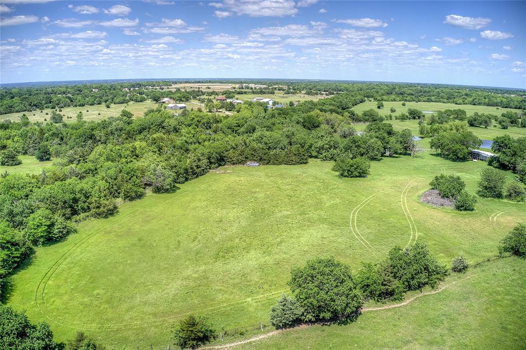 5101 Pecan Creek Road Celeste, TX 75423 - Photo 11 of 23 a view of a yard with an outdoor space
