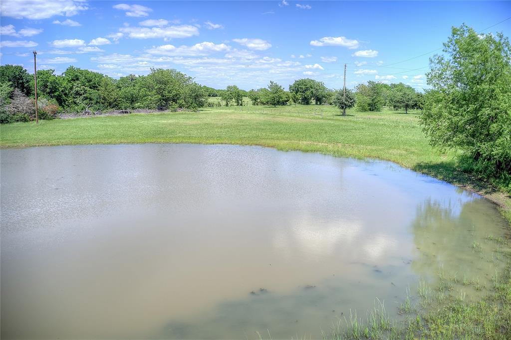 5101 Pecan Creek Road Celeste, TX 75423 - Photo 18 of 23 a view of a golf course with a lake