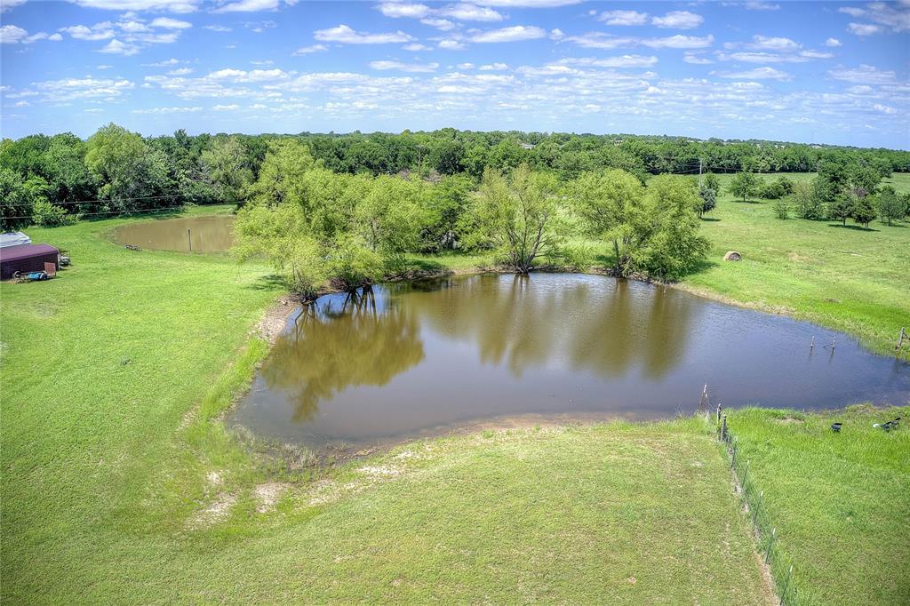 5101 Pecan Creek Road Celeste, TX 75423 - Photo 19 of 23 a view of a lake with a yard