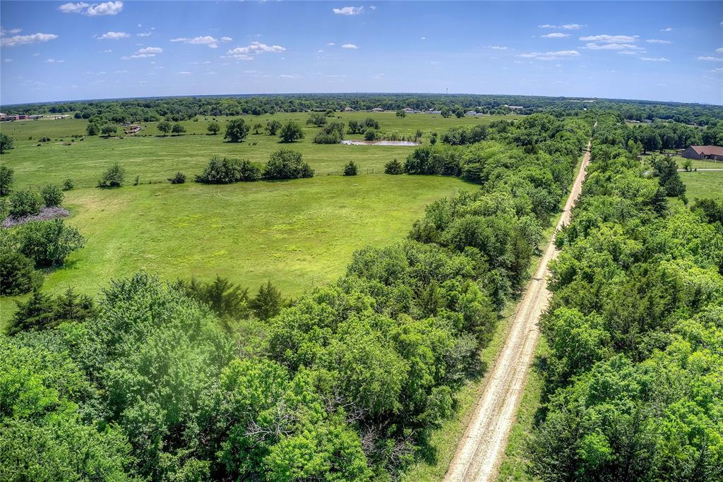 5101 Pecan Creek Road Celeste, TX 75423 - Photo 23 of 23 a view of a lush green outdoor space with a lake view
