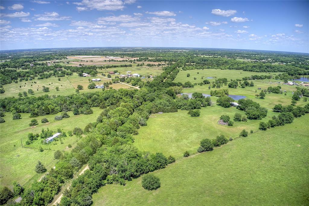 5101 Pecan Creek Road Celeste, TX 75423 - Photo 9 of 23 a view of a lush green field