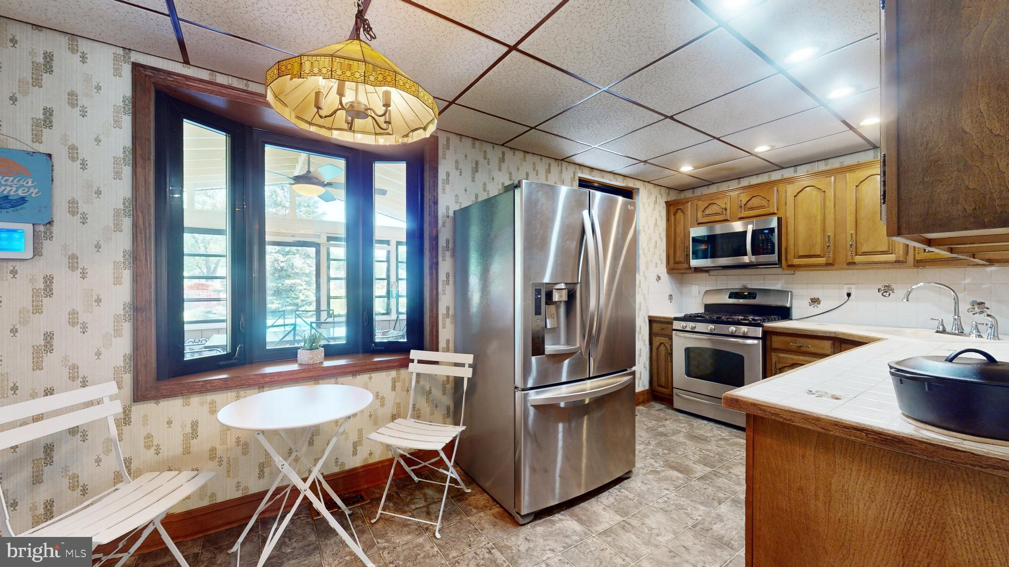 221 Tuscany Road Aston, PA 19014 - Photo 7 of 29 Access to Three Season Sunroom from Kitchen