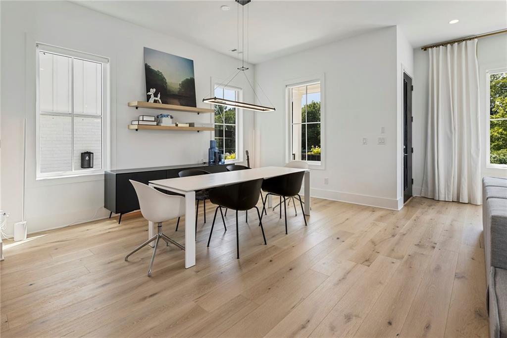 6715 Halcyon Way Alpharetta, GA 30005 - Photo 12 of 60 a view of a dining room with furniture and wooden floor