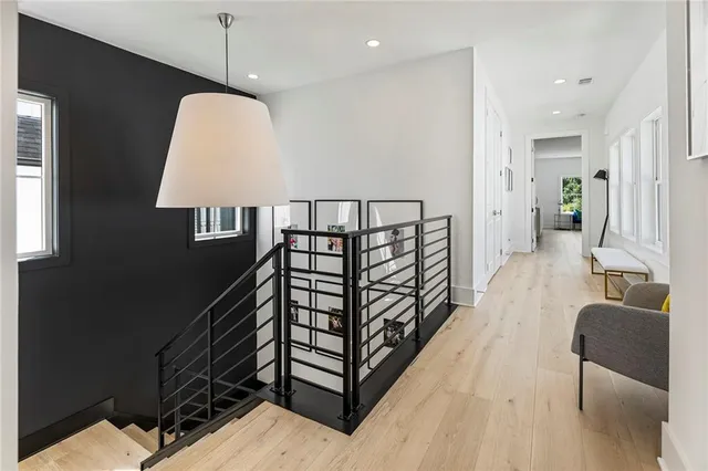 a bed room with a bed and a chandelier