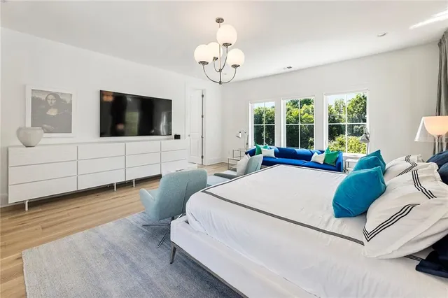 a bathroom with mirror and shower