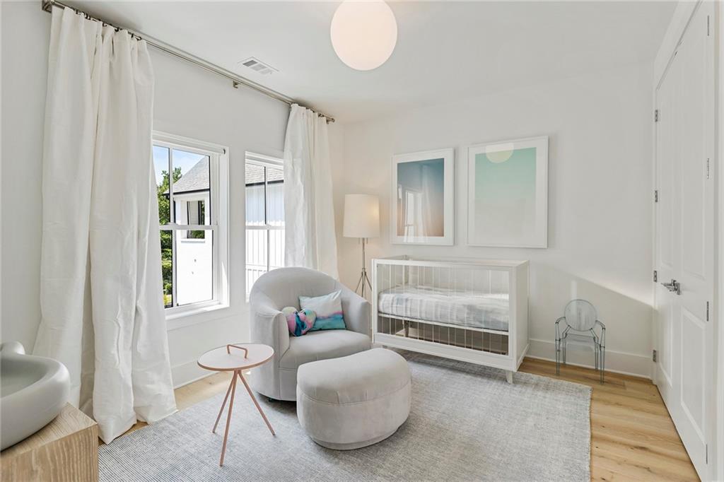 6715 Halcyon Way Alpharetta, GA 30005 - Photo 32 of 60 a living room with furniture and a window