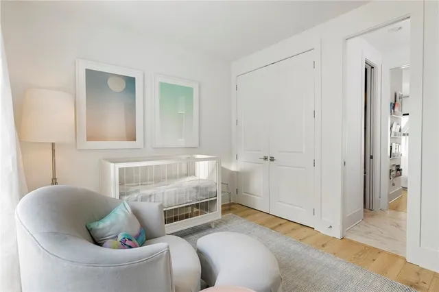 a bedroom with bed and window