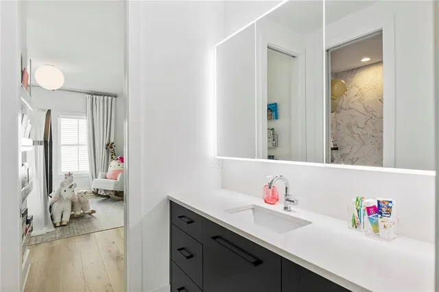 a bathroom with a sink toilet and shower