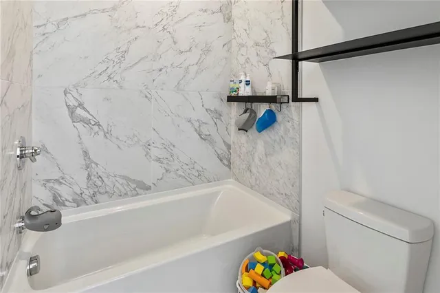 a kitchen with stainless steel appliances a refrigerator and sink