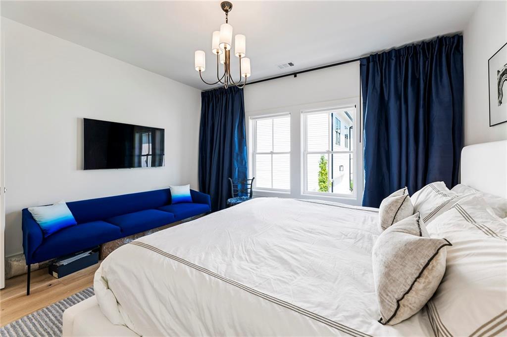 6715 Halcyon Way Alpharetta, GA 30005 - Photo 39 of 60 a bedroom with bed and window