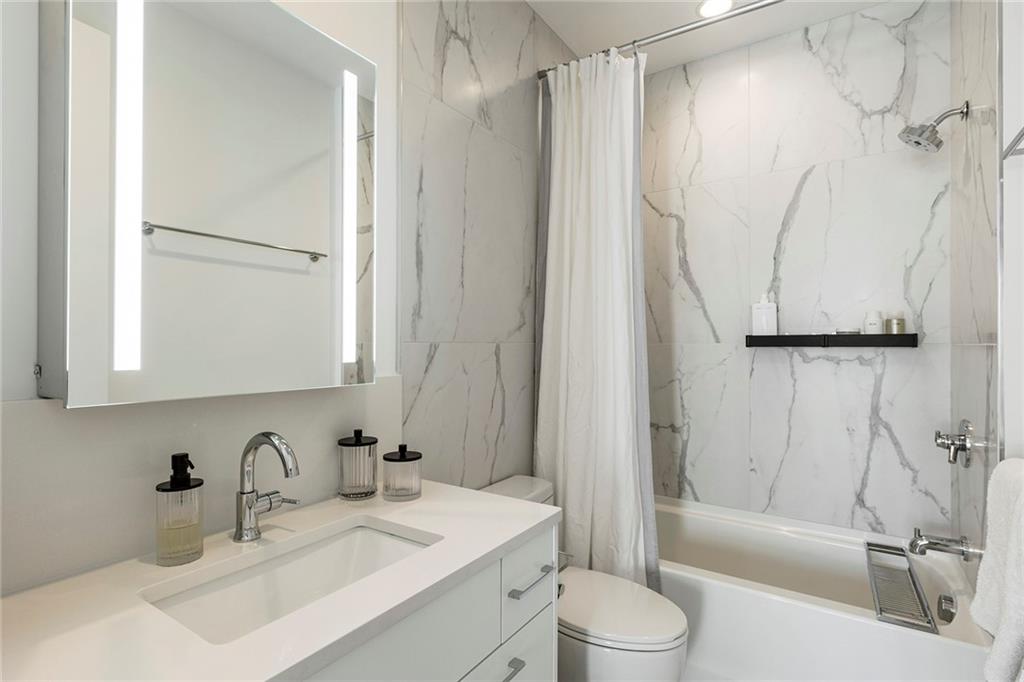 6715 Halcyon Way Alpharetta, GA 30005 - Photo 40 of 60 a bathroom with a sink toilet and shower