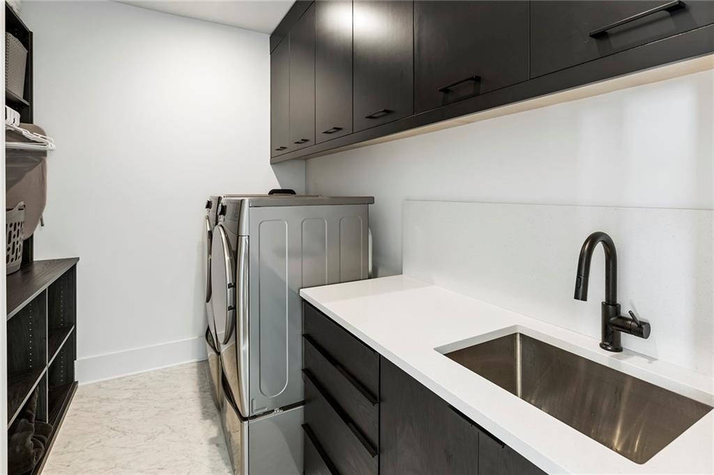 6715 Halcyon Way Alpharetta, GA 30005 - Photo 41 of 60 a kitchen with stainless steel appliances a refrigerator and sink