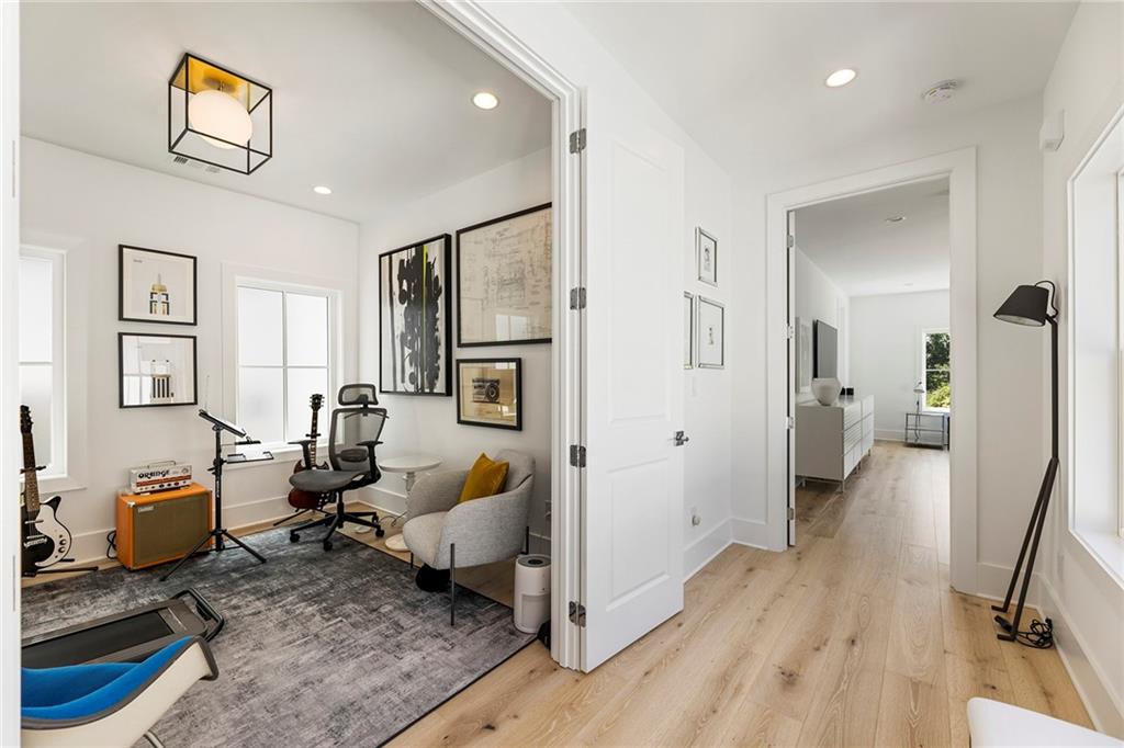 6715 Halcyon Way Alpharetta, GA 30005 - Photo 42 of 60 a living room with furniture and a wooden floor