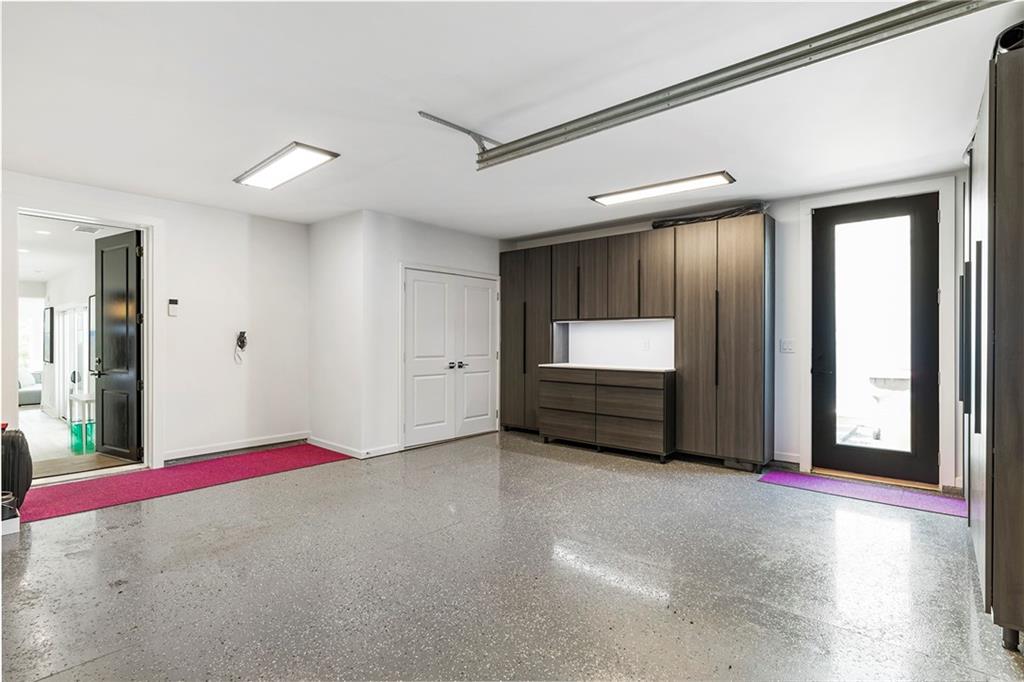 6715 Halcyon Way Alpharetta, GA 30005 - Photo 45 of 60 a view of an empty room with a fireplace and a window