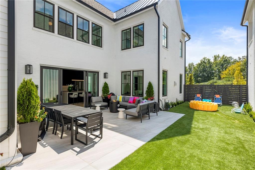 6715 Halcyon Way Alpharetta, GA 30005 - Photo 47 of 60 a view of a house with backyard porch and furniture
