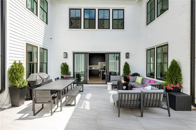 a living room with furniture and a potted plant