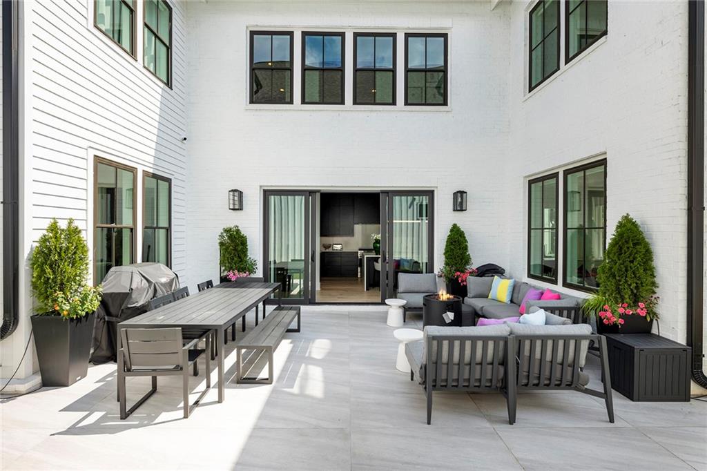 6715 Halcyon Way Alpharetta, GA 30005 - Photo 6 of 60 a living room with furniture and a potted plant