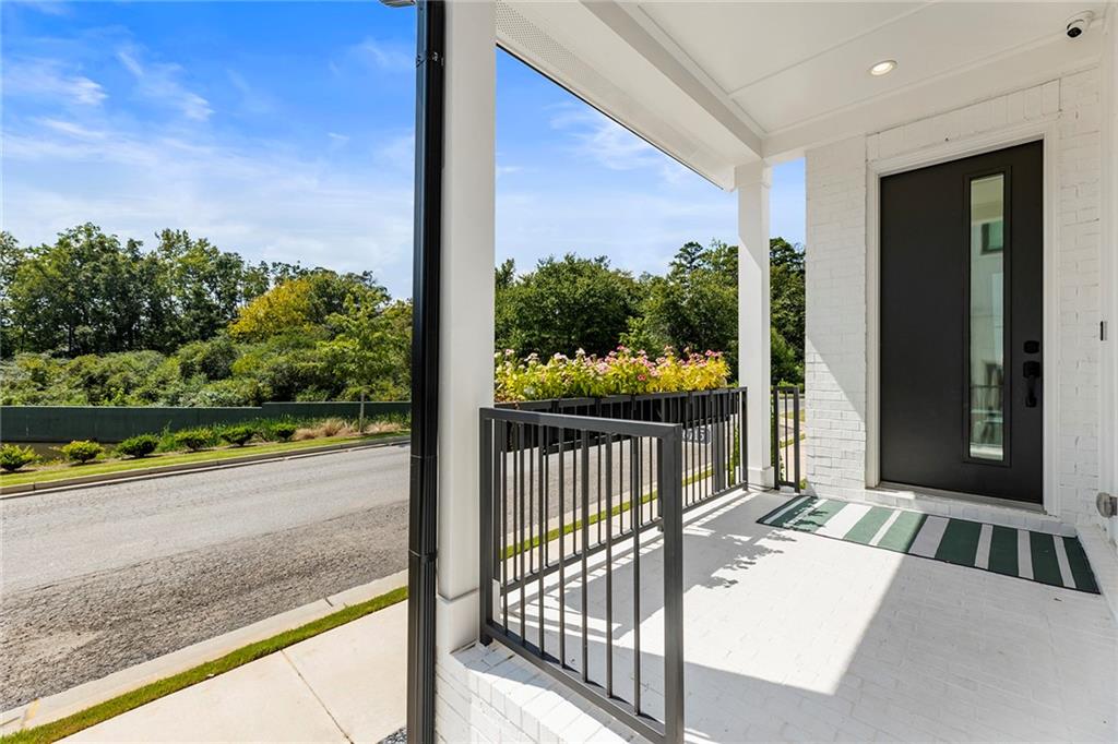 6715 Halcyon Way Alpharetta, GA 30005 - Photo 8 of 60 a view of a floor to ceiling window and a yard