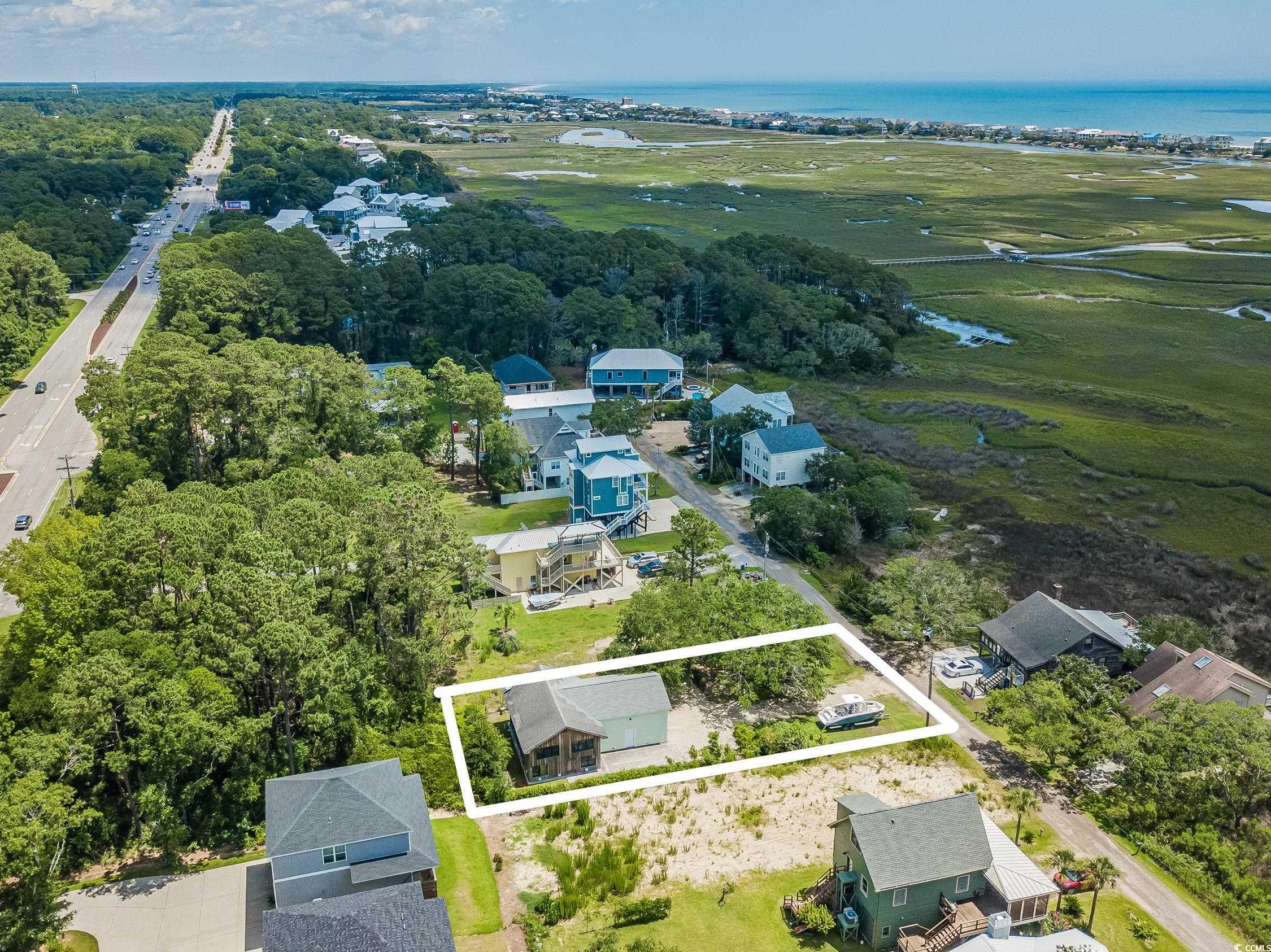 127 Brown Pelican Loop Pawleys Island, SC 29585 - Photo 27 of 31 Aerial overview of property's location with property boundaries highlighted and a nearby body of water