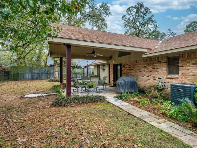 a view of a patio in a backyard