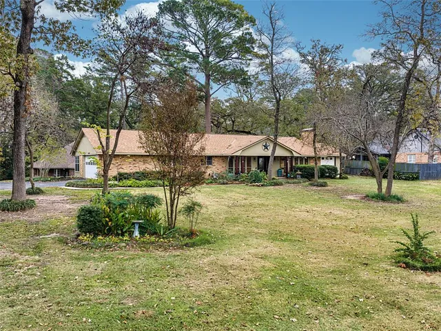 a view of a house with pool and sitting area