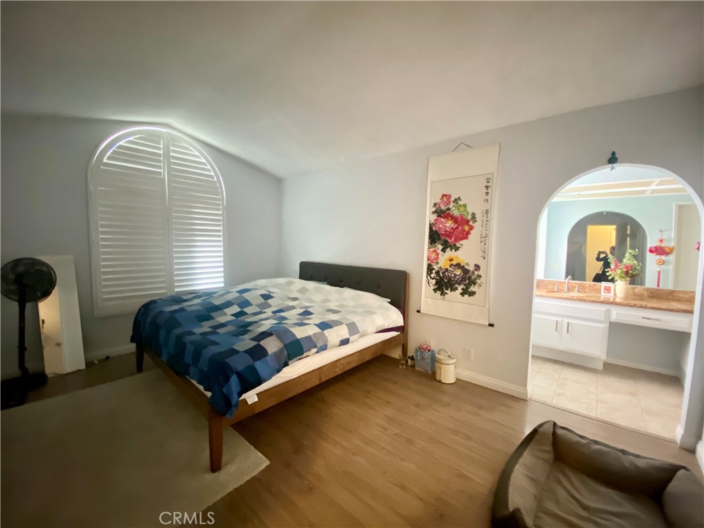 3 Cll Del Rey Phillips Ranch, CA 91766 - Photo 11 of 25 a bedroom with a bed and a dresser