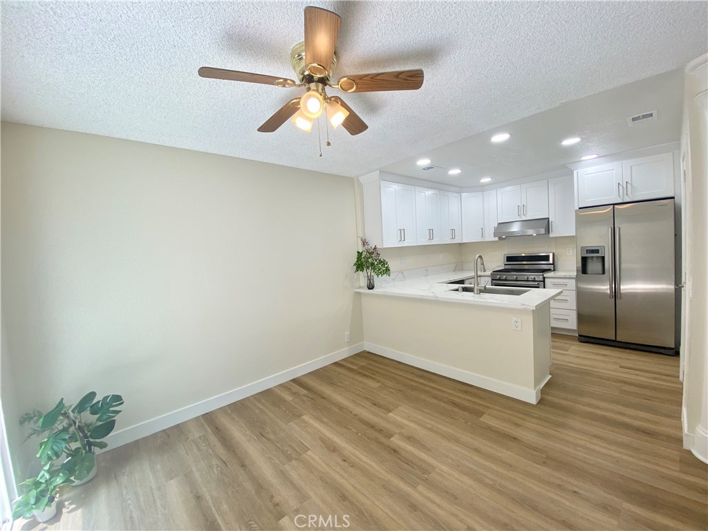 3 Cll Del Rey Phillips Ranch, CA 91766 - Photo 2 of 25 a view of kitchen with sink and refrigerator