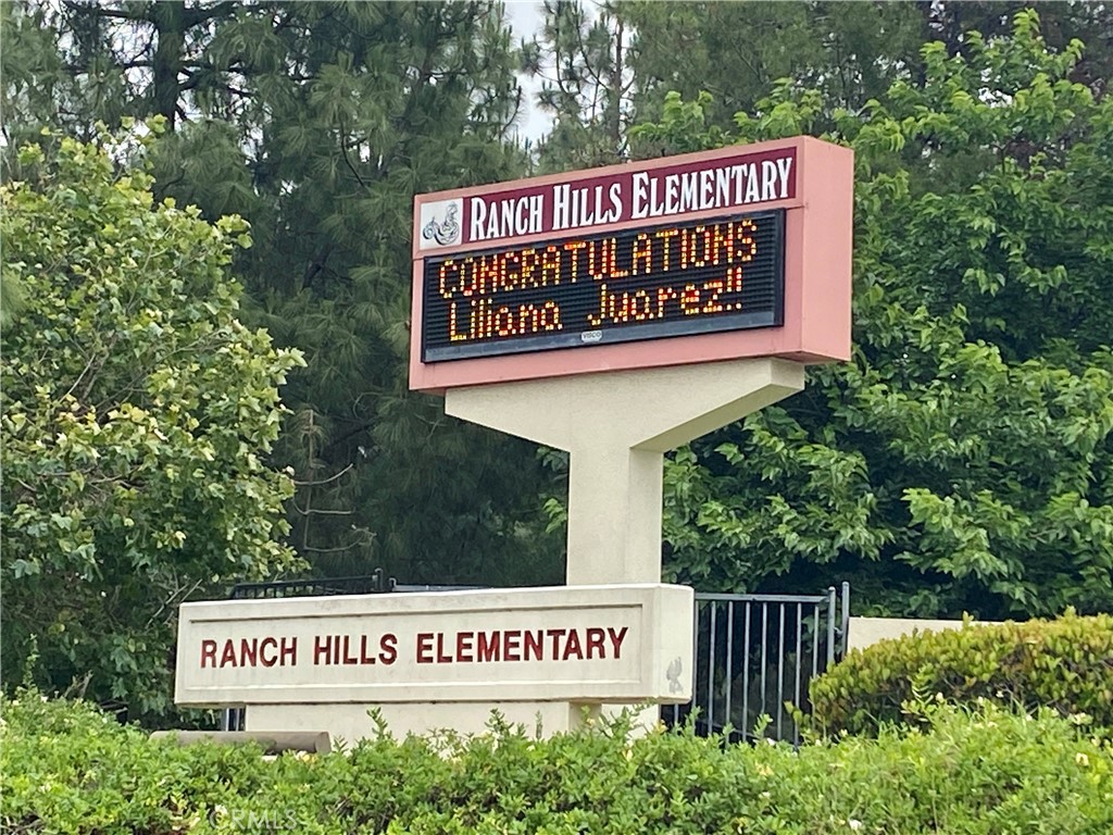 3 Cll Del Rey Phillips Ranch, CA 91766 - Photo 22 of 25 a sign broad on wooden deck