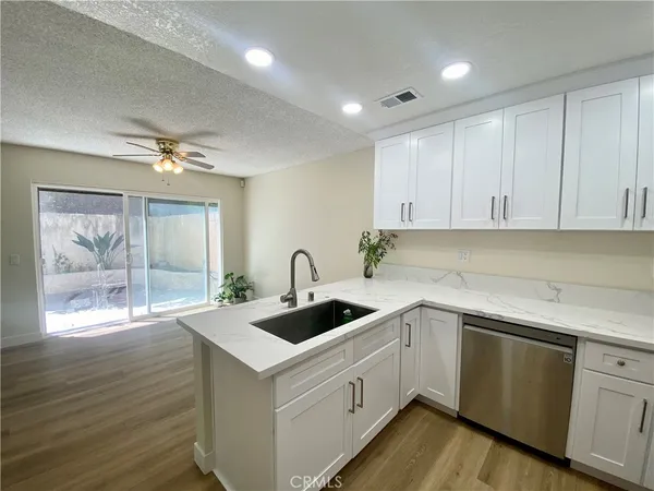 a kitchen with a sink and cabinets