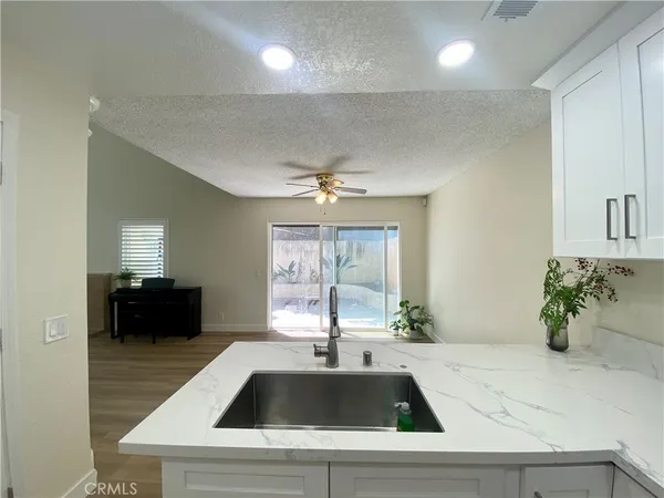 a kitchen with a sink and a refrigerator
