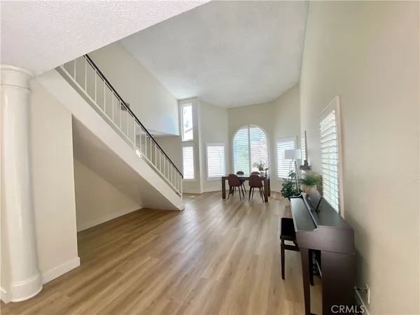 a view of a livingroom with furniture and hardwood floor