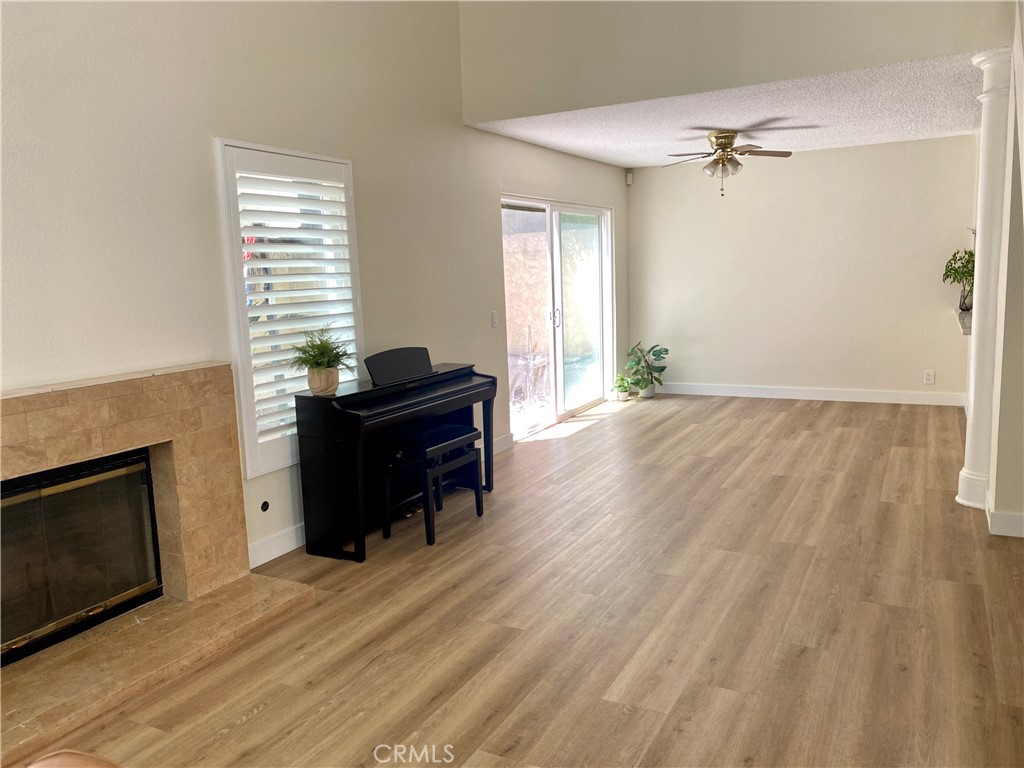 3 Cll Del Rey Phillips Ranch, CA 91766 - Photo 8 of 25 a view of a livingroom with a fireplace and a window