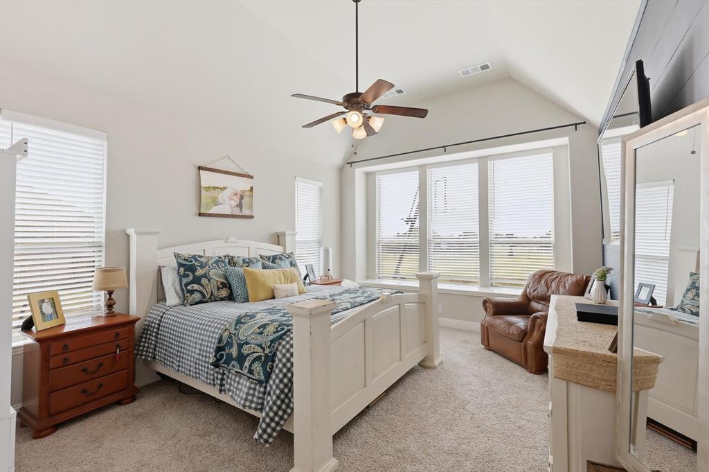 3120 Jessup Circle Blue Ridge, TX 75424 - Photo 18 of 35 a bedroom with a bed and a chandelier