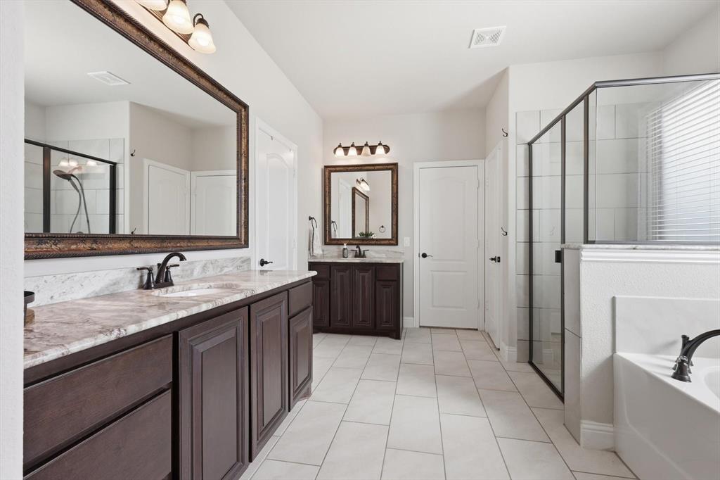 3120 Jessup Circle Blue Ridge, TX 75424 - Photo 19 of 35 a bathroom with a granite countertop sink a mirror and a shower