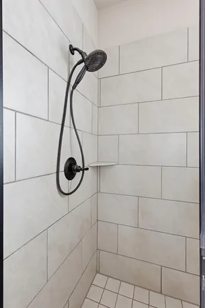 a bathroom with a bathtub and a shower