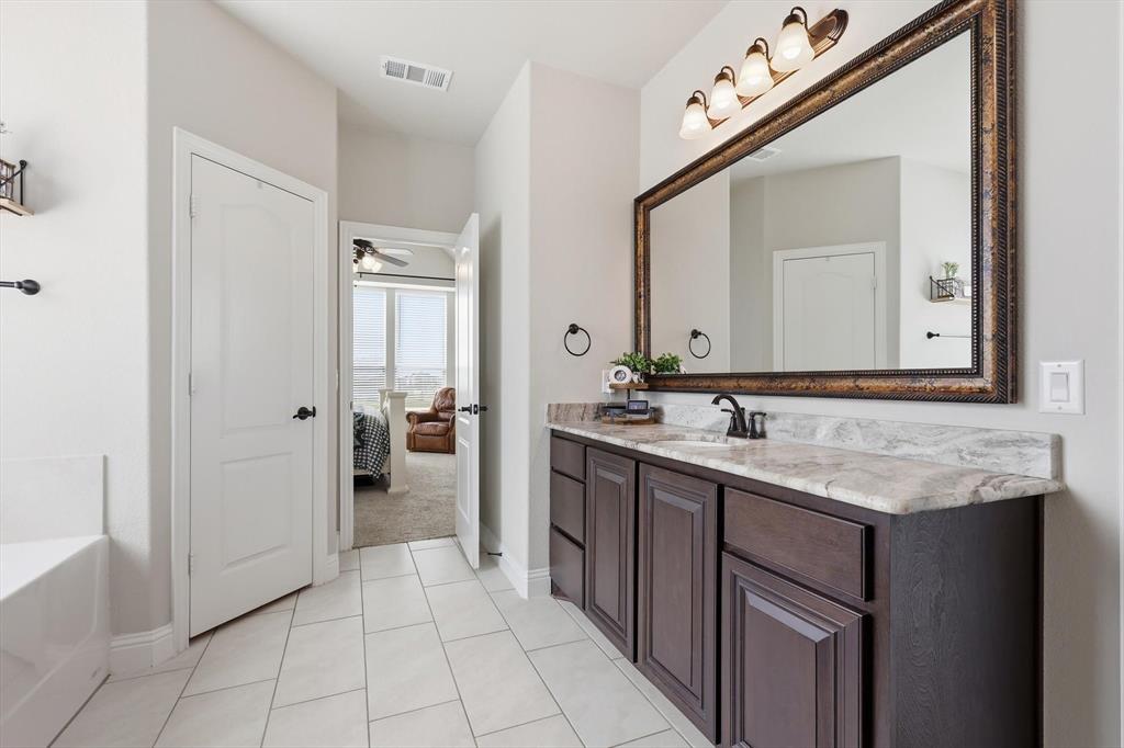 3120 Jessup Circle Blue Ridge, TX 75424 - Photo 22 of 35 a bathroom with a sink and a mirror