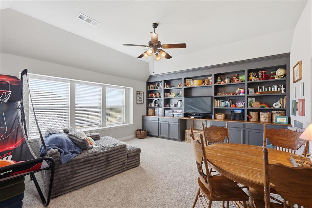 3120 Jessup Circle Blue Ridge, TX 75424 - Photo 24 of 35 a living room with furniture a bookshelf and a large window