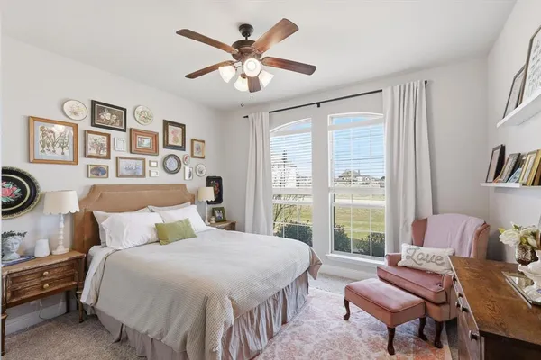 a bedroom with a bed and a bookshelf