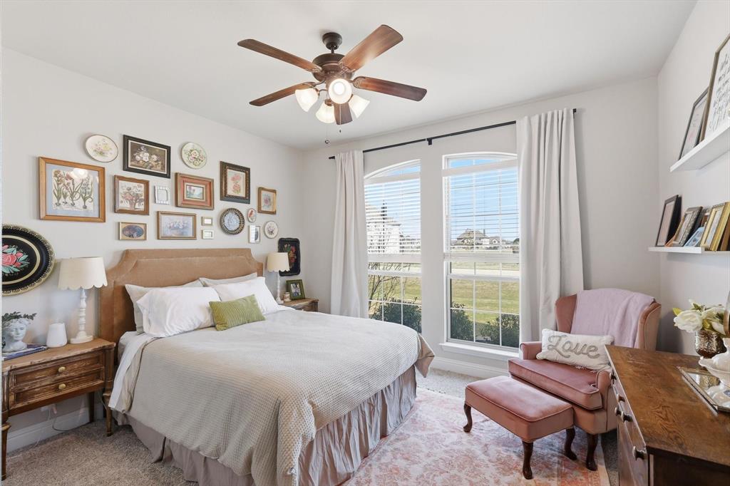 3120 Jessup Circle Blue Ridge, TX 75424 - Photo 30 of 35 a bedroom with a bed and a chandelier