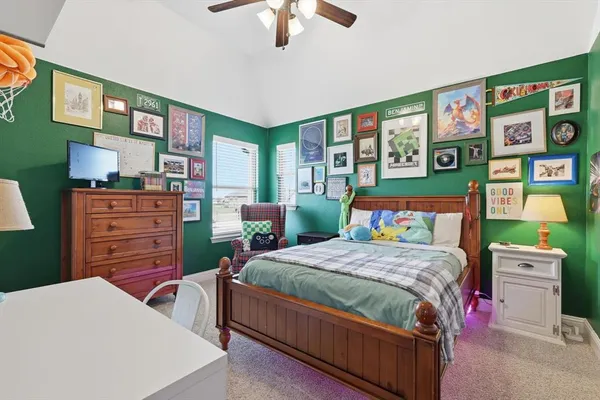a bedroom with two beds and a chandelier