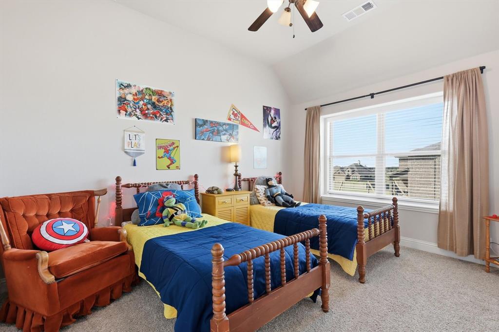 3120 Jessup Circle Blue Ridge, TX 75424 - Photo 32 of 35 a bedroom with two beds and a chandelier