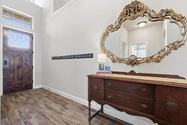 a view of a hallway with front door