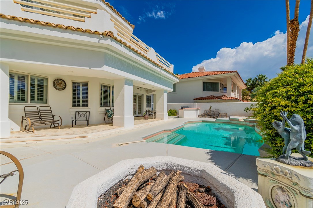 23 Cascade Creek Lane Las Vegas, NV 89113 - Photo 21 of 89 Rear view of property featuring a patio area, a tile roof, stucco siding, and a chimney