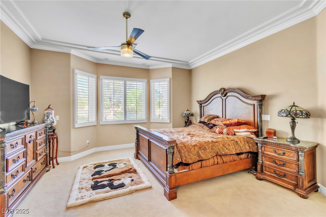 23 Cascade Creek Lane Las Vegas, NV 89113 - Photo 29 of 89 Bedroom featuring ornamental molding, light colored carpet, and ceiling fan