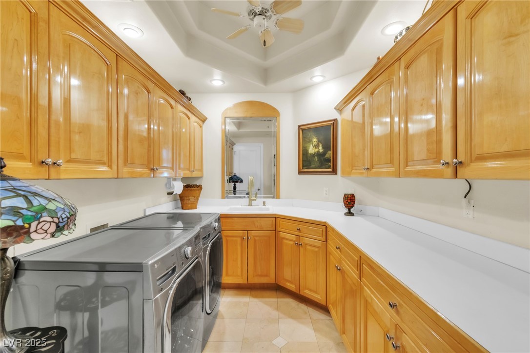 23 Cascade Creek Lane Las Vegas, NV 89113 - Photo 42 of 89 Washroom with washer and clothes dryer, light tile patterned floors, cabinet space, recessed lighting, and ceiling fan