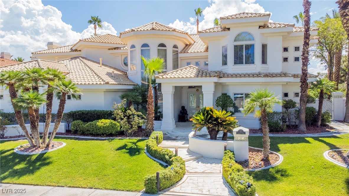 23 Cascade Creek Lane Las Vegas, NV 89113 - Photo 5 of 89 View of front of property with a front yard, stucco siding, and a tiled roof