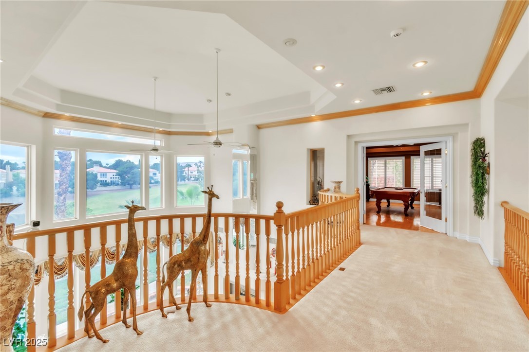 23 Cascade Creek Lane Las Vegas, NV 89113 - Photo 56 of 89 Hallway featuring a tray ceiling, carpet, recessed lighting, an upstairs landing, and ornamental molding